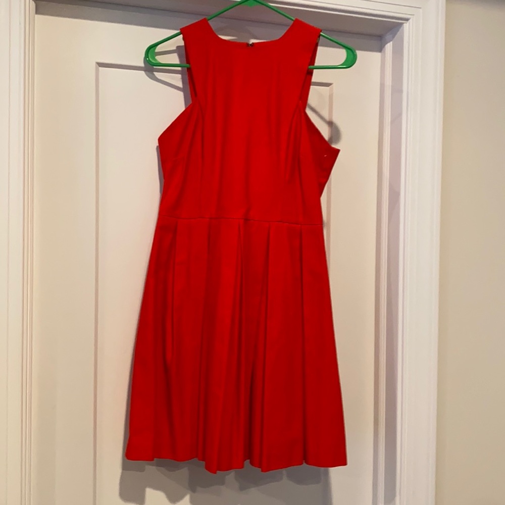 Bright red pleated dress with unique arm details